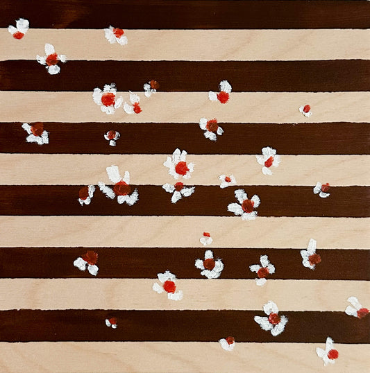 A brown and wood striped background with small white flowers with orange centers scattered across the art.