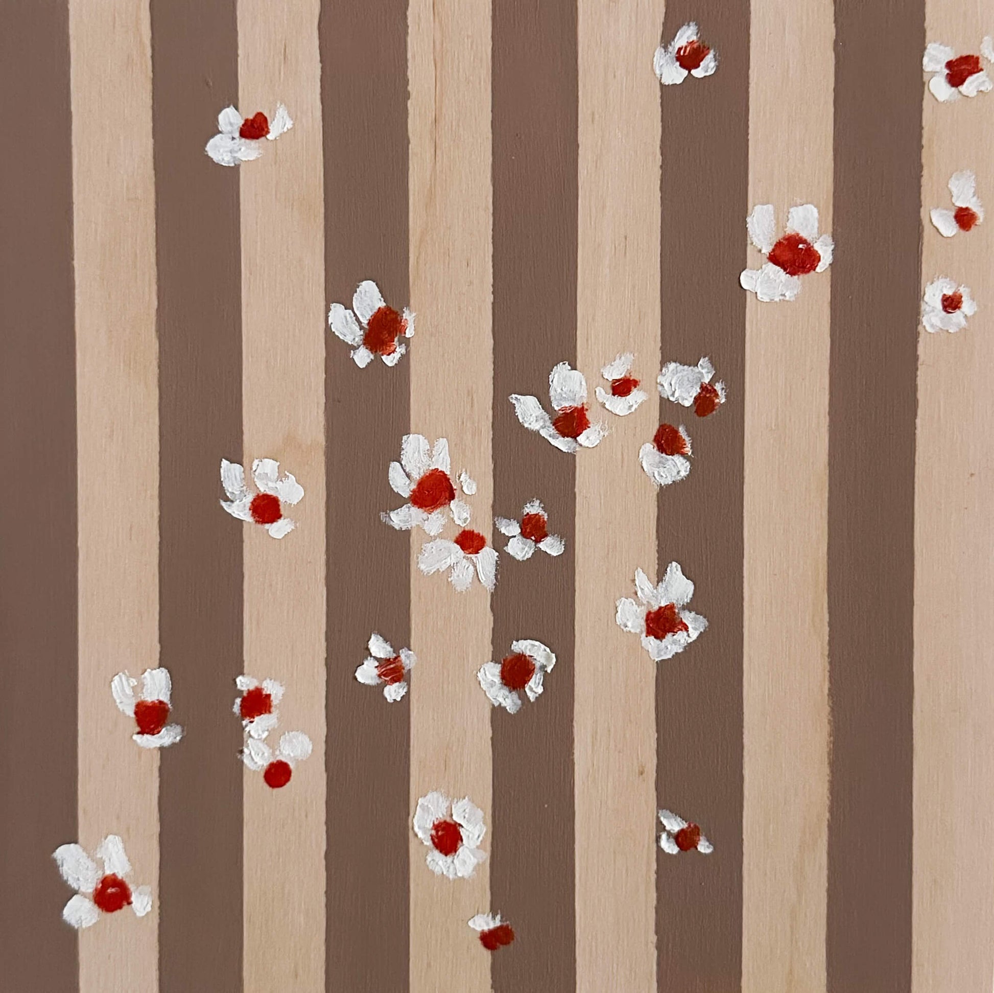 Pattern of white flowers with red centers on brown and wood striped wood panel