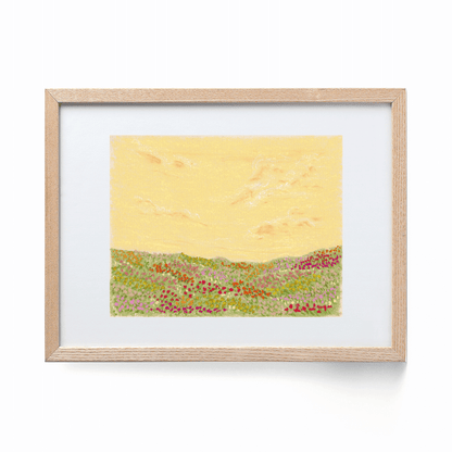 A colorful landscape print framed in a wood frame. The print shows a colorful flower field with a yellow sky.