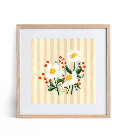 Framed artwork of flowers on a striped background