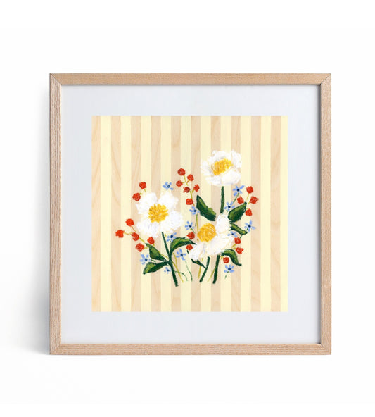 Framed artwork of flowers on a striped background