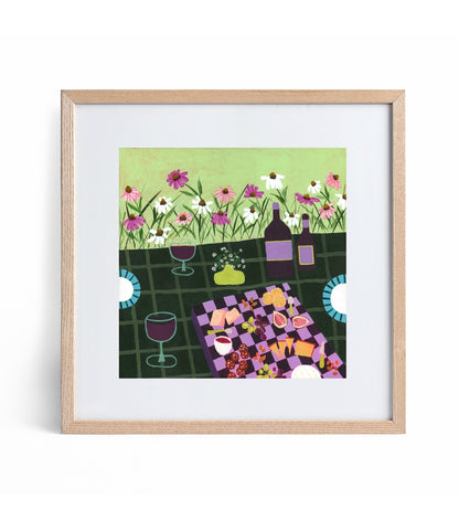 Framed artwork of a garden party scene with flowers, bottles, and tableware.
