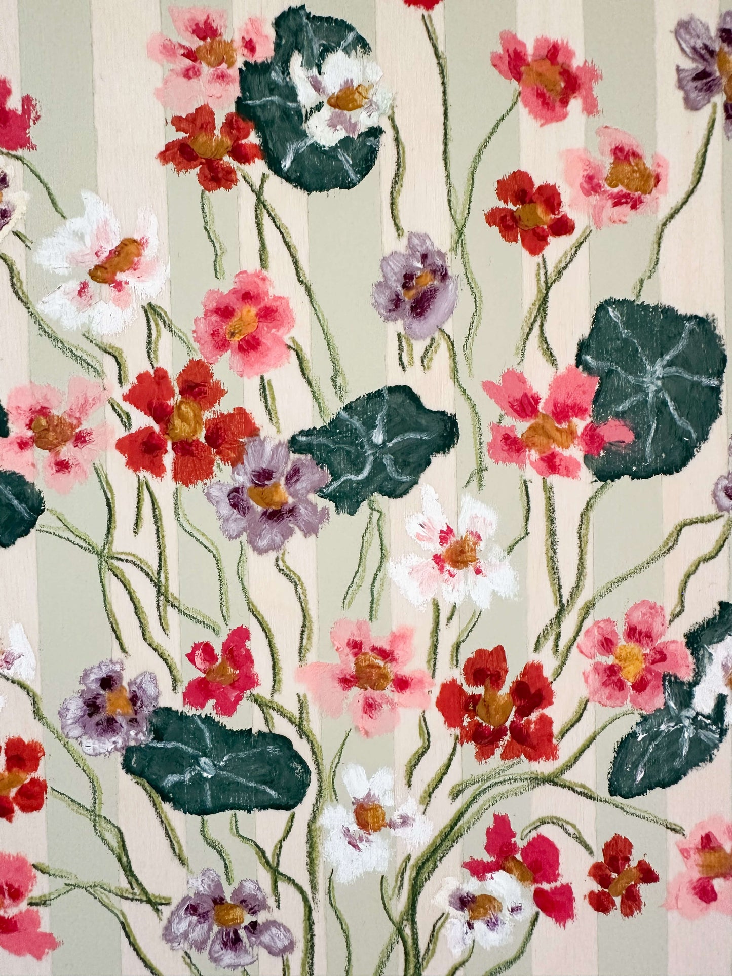 Floral pattern with pink, red, and purple flowers on a light background
