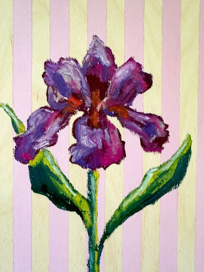 Painting of a purple flower with green leaves on a striped background