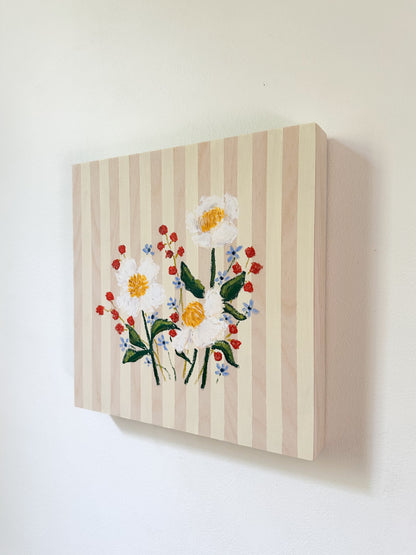 Canvas painting of flowers on a striped background