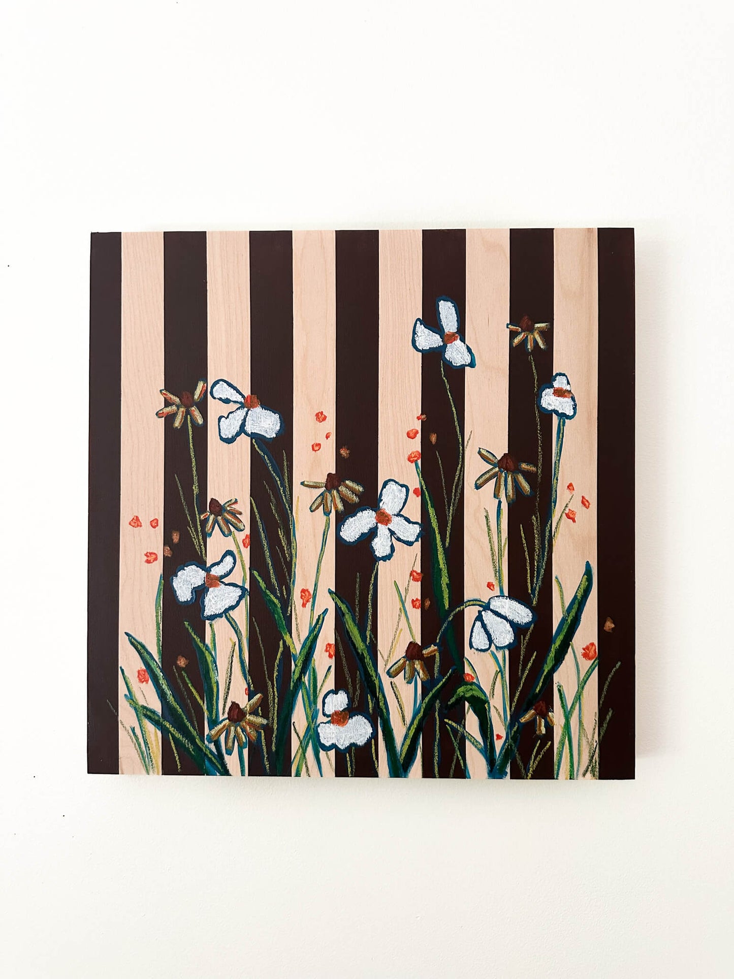 brown striped painting on wood background with white and orange flowers.