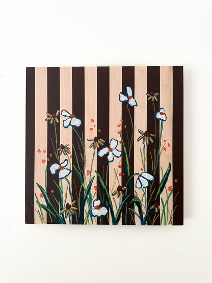 brown striped painting on wood background with white and orange flowers.