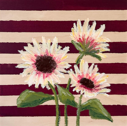 Oil pastel painted sunflowers painted on a red and wood striped, painted wood panel.