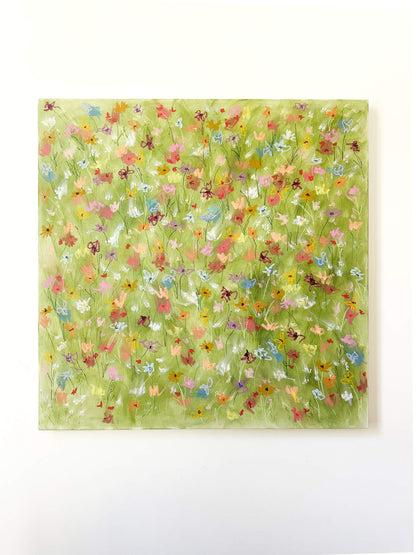 Framed artwork with a colorful floral pattern on a green background