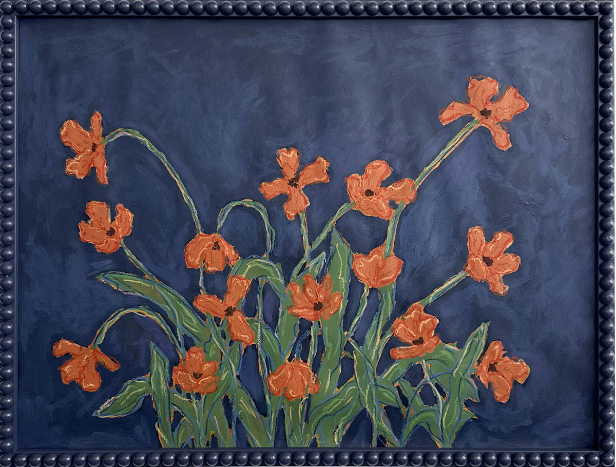 A painting of orange flowers with green leaves on a  deep blue background framed in a deep blue bobbin frame.