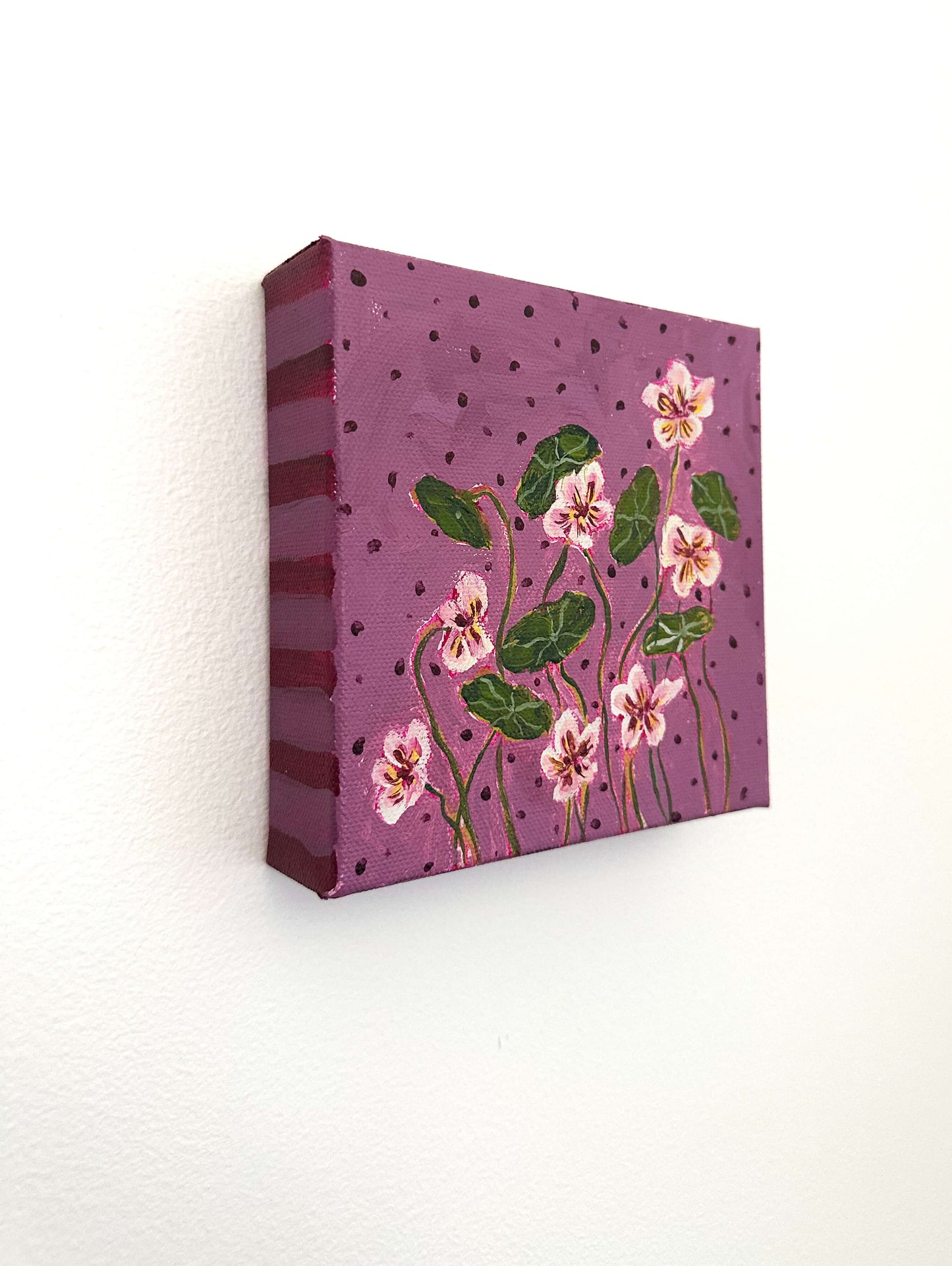 Canvas print with floral design on a purple background