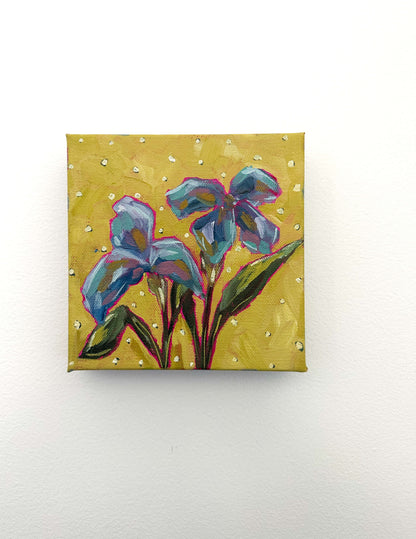 Painting of blue flowers on a yellow background