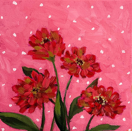 red zinnias on pink polka dot background