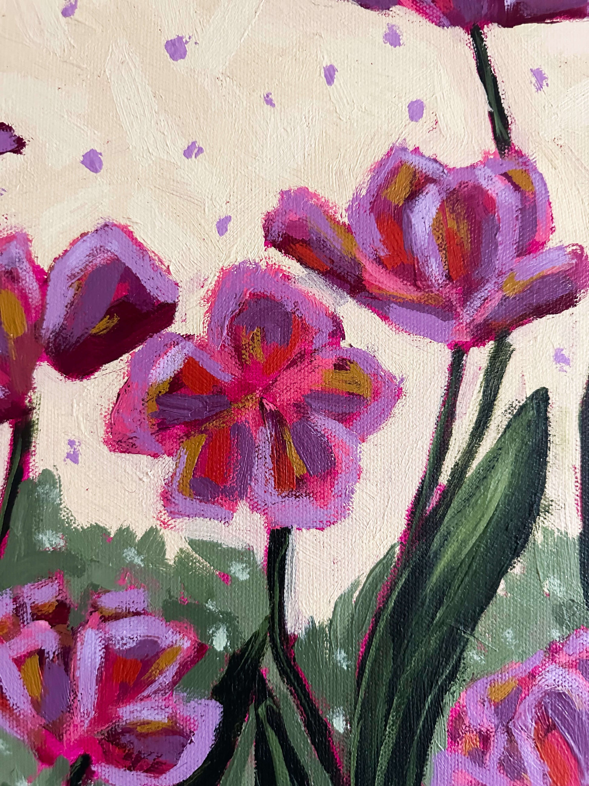Colorful tulip flowers on a light yellow and purple polka dot background