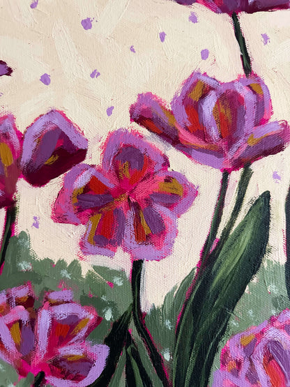 Colorful tulip flowers on a light yellow and purple polka dot background