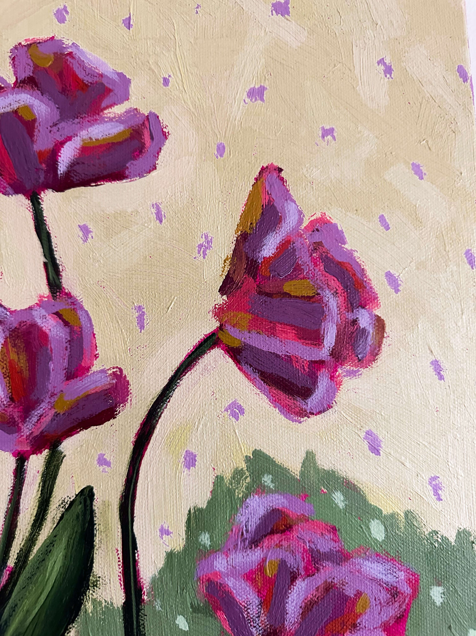 Painting of purple flowers on a light yellow and polka dot background