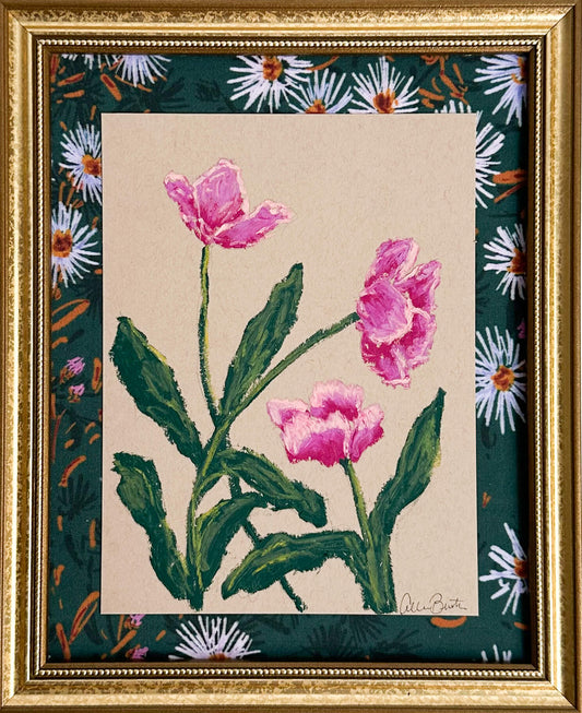 pink flowers painted on tan paper and mounted on floral fabric in a gold frame.