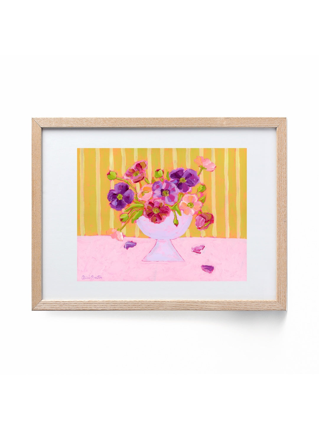 Framed artwork of a colorful bouquet of flowers on a yellow and pink striped background.