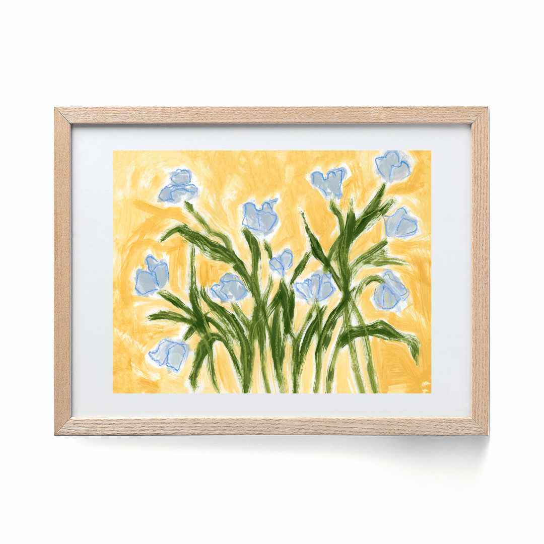 blue tulips on a yellow background framed in a wood frame