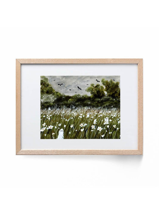 Framed artwork of a landscape with trees, ghosts, and flowers on a white background