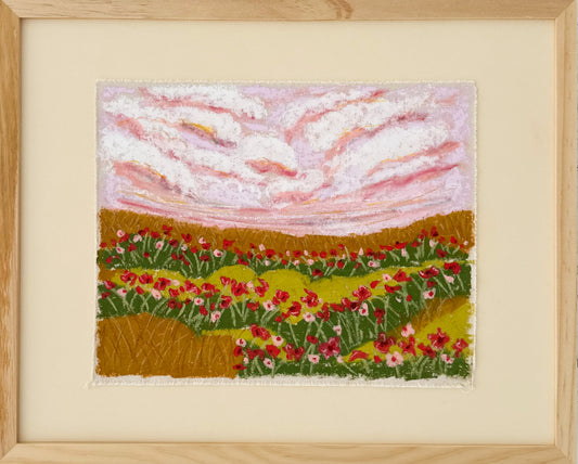 Framed canvas art piece depicting a landscape with flowers and clouds.